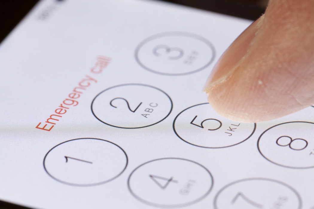 A person makes an emergency call for help