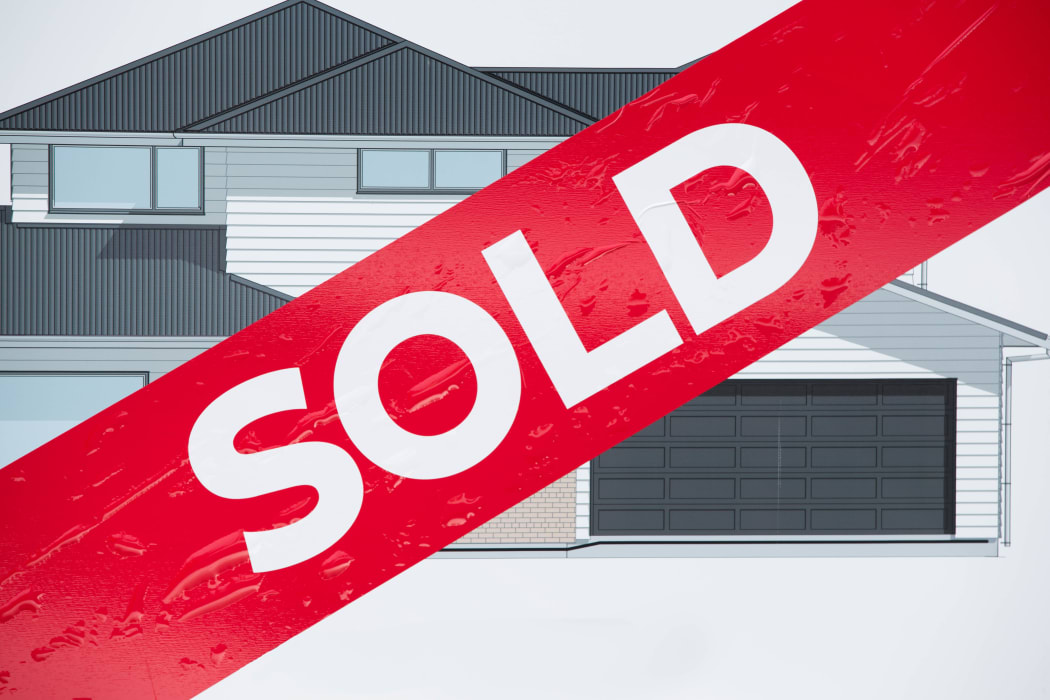 Sold sign outside a new house being built in East Auckland