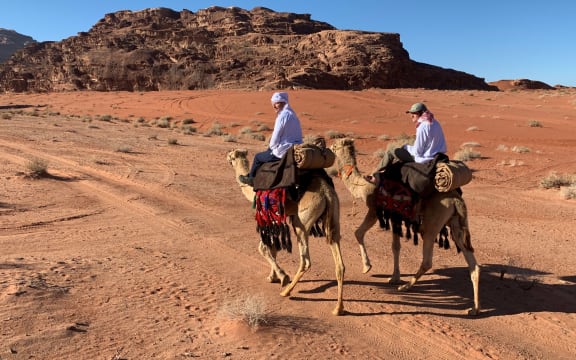 Andrew Bayly and his son Dan on camels.