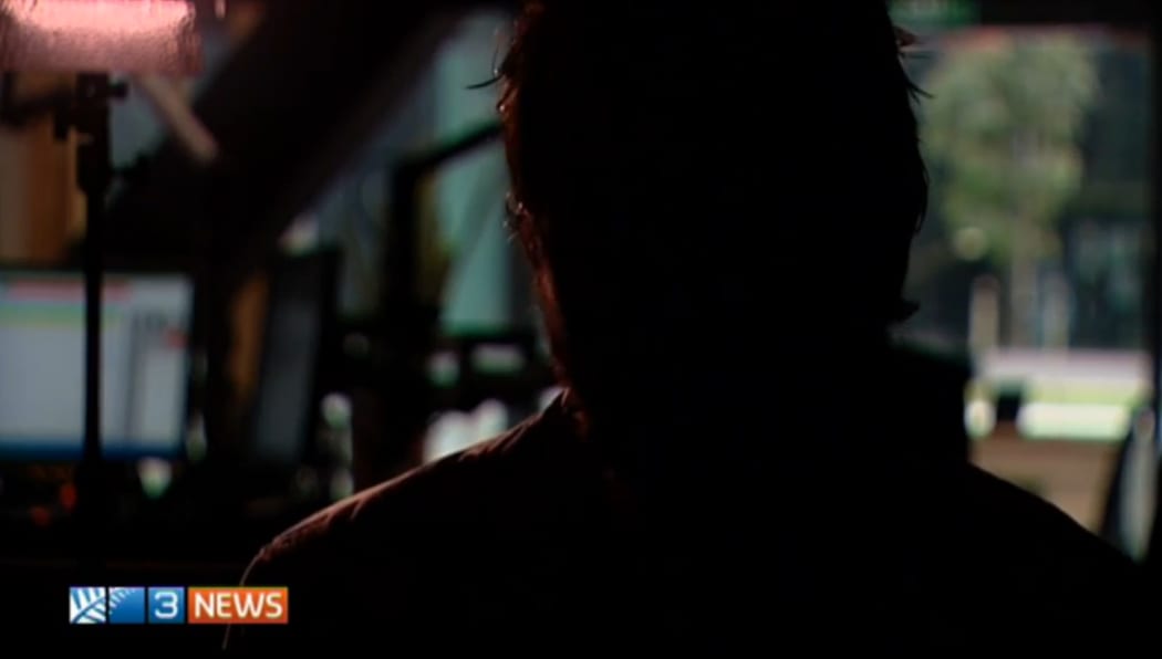 Picture of a convicted offender on 3 News with his face hidden in shadow.