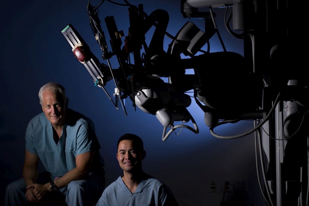 Urologists Dr. Thomas Ahlering and Dr. Michael Louie work with the latest robotic machinery, such as the da Vinci Surgical System robot at UC Irvine Medical Center, to battle cancer.