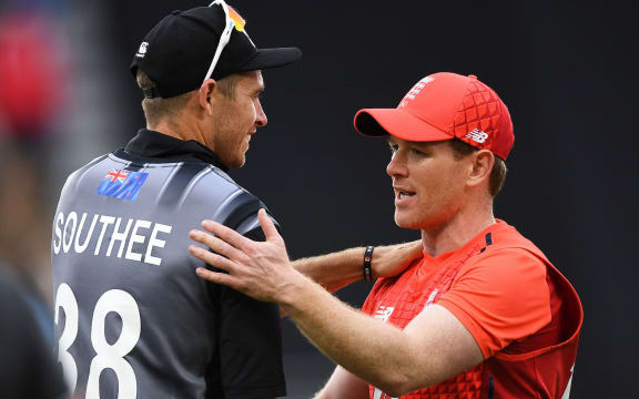 England captain Eoin Morgan consoles New Zealand captain Tim Southee at the conclusion of the super over. New Zealand Black Caps v England Twenty20 Cricket match at Eden Park.