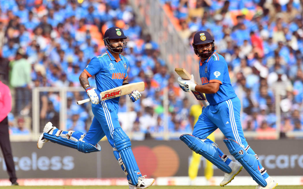 India's Virat Kohli (L) and captain Rohit Sharma cross for a run during the ICC Cricket World Cup 2023 Finals match between India and Australia at the Sardar Vallabhbhai Patel Sports Enclave, Gujarat Cricket Association Stadium in Ahmedabad, Gujarat, India. Sunday, 19 November 2023.