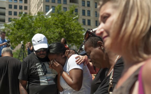 People gather for a vigil for the victims of the mass shooting in Dayton, Ohio.