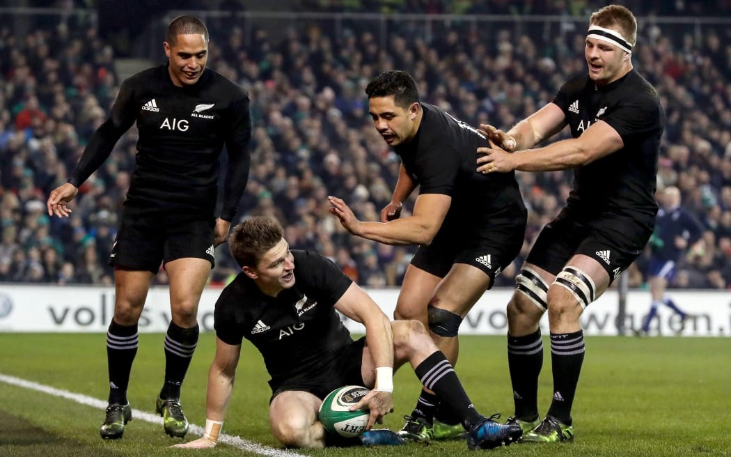 Beauden Barrett celebrates scoring a try against Ireland in Dublin.