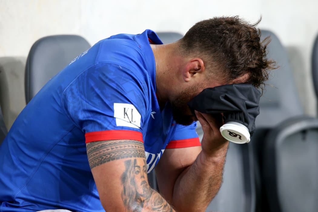 Manu Samoa captain Jack Lam nurses a eye injury on the sideline.