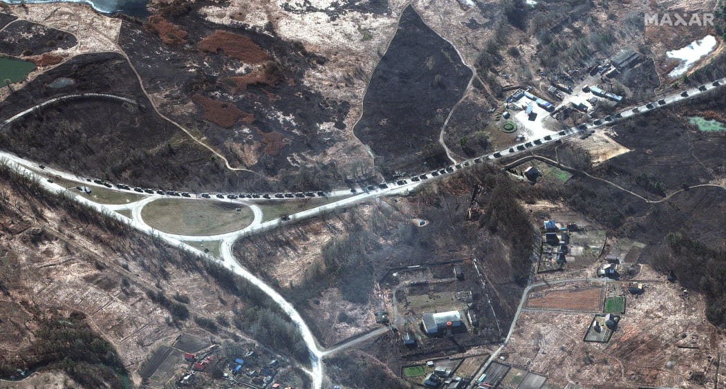 Satellite image taken by private satellite company Maxar shows that the 64-km long Russian military convoy reached outskirts of Kharkov, Ukraine, on Monday Feb 28, 2022.