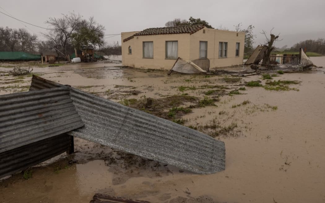 Flood waters inundate a home by the Salinas River near Chualar, California.