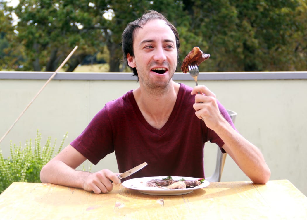 Picture of Hamish Parkinson eating meat