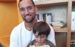 Former All Black Aaron Cruden with son Cooper aged 4 enjoy Wriggle and Rhyme at Te Kete Aronui Rototuna Library in Hamilton.