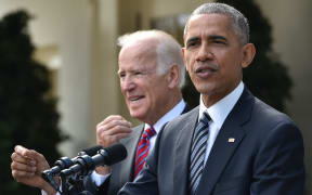 President Barack Obama,  with Vice President Joe Biden, at left) addresses the nation after Donald Trump's election victory.