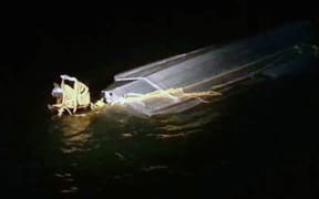 A supplied picture of the capsized boat in the Firth of Thames.