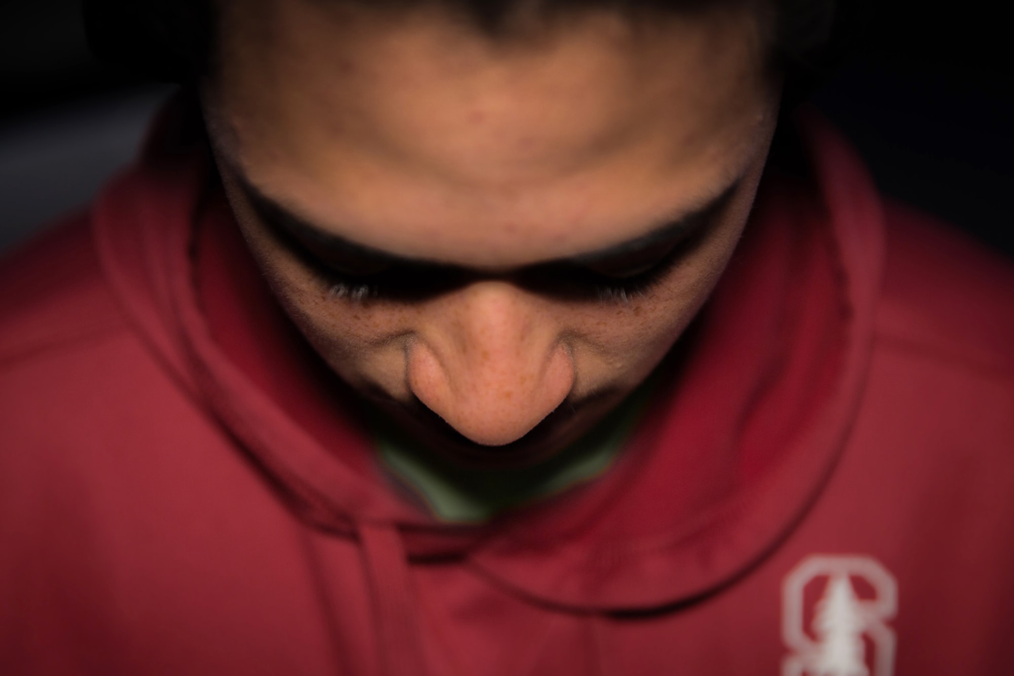 A teenage Māori boy looking unhappy