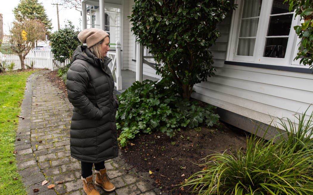 Patrice Lobb looking at the former site of works at her property