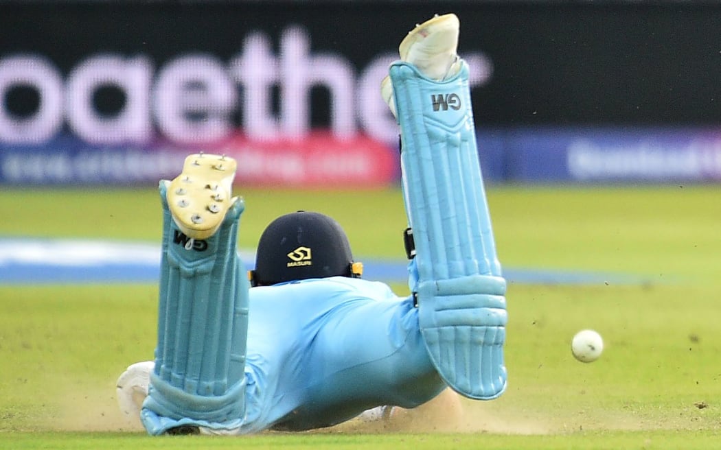 The ball hits England's Ben Stokes, deflecting to reach the boundary as he dives to make his ground during the 2019 Cricket World Cup final.
