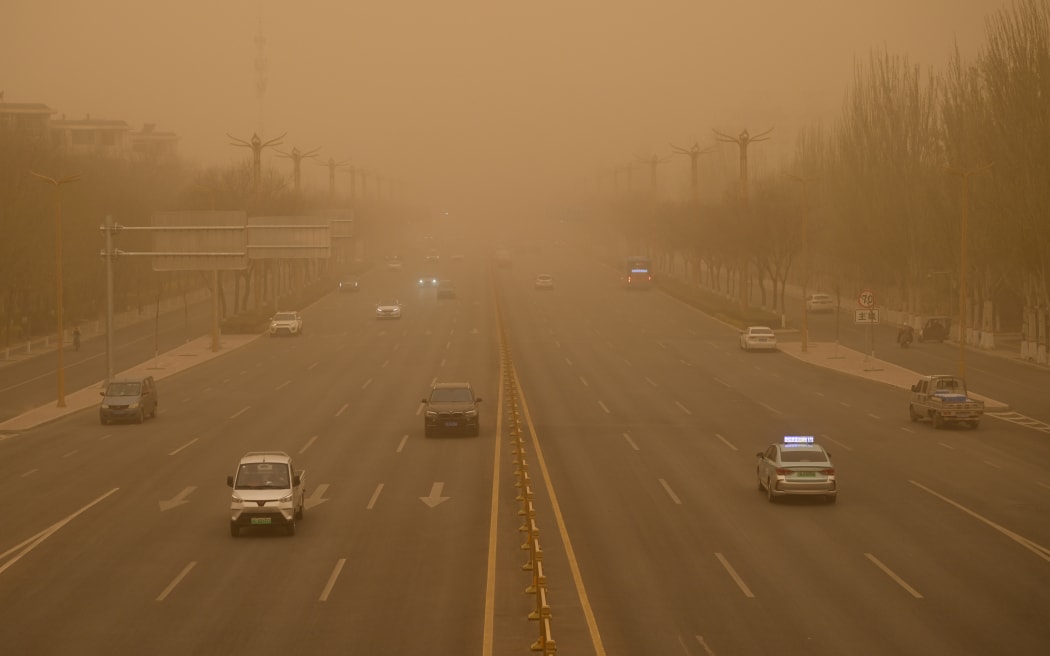 Vehicles driving during sandstorm in Yinchuan, Ningxia province, China on 11 April, 2025.