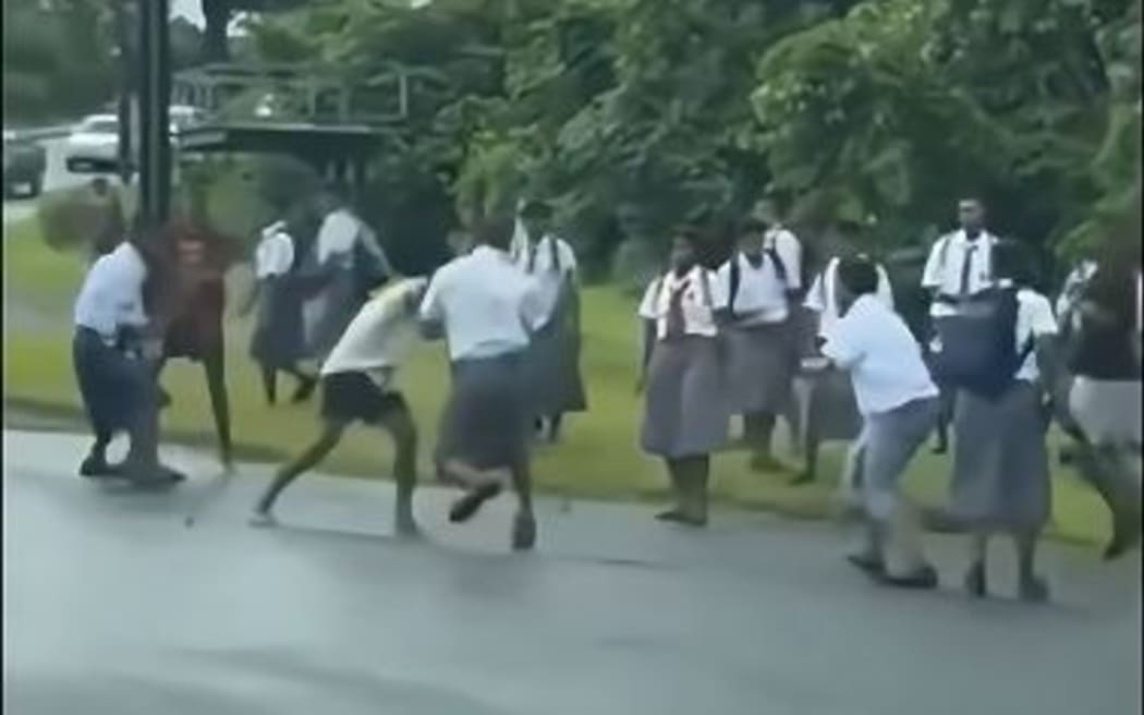 More than a dozens young students in uniform and can be seen brawling on the main road, with coming to a stand-still. on 11 February 2025.