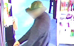 CCTV image of a man in relation to an ongoing homicide investigation in Northland. The images were edited by NZ Police around the man's face before publication by media.