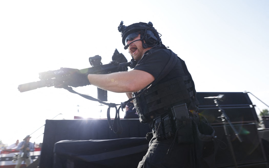 A law enforcement officer responds, after the shots, at the Republican rally in Butler, Pennsylvania, on 13 July, 2024.