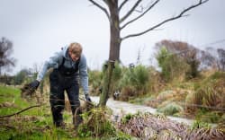 Adam McManaway trying to restore power to fences to stop stock getting out on Kaikōura’s Rorrisons Road after heavy rain on July 8, 2026.