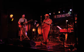 Saxophonist Thabani Gapara on stage.