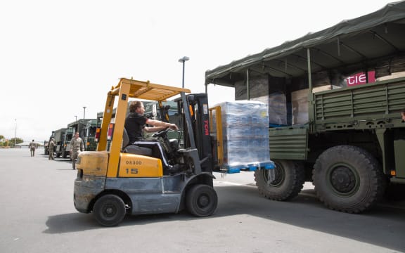 A forklift collects supplies from the 2nd army convoy to arrive in Kaikoura.