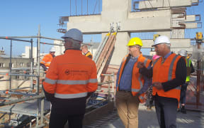 Regional Development Minister Stuart Nash reviewing progress at Invercargill's inner city development with officials on 18 March, 2021.