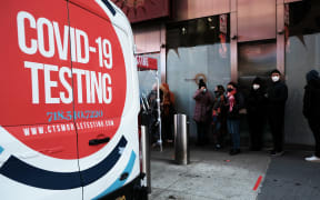 : People wait in long lines in Times Square to get tested for Covid-19 on December 20, 2021 in New York City.