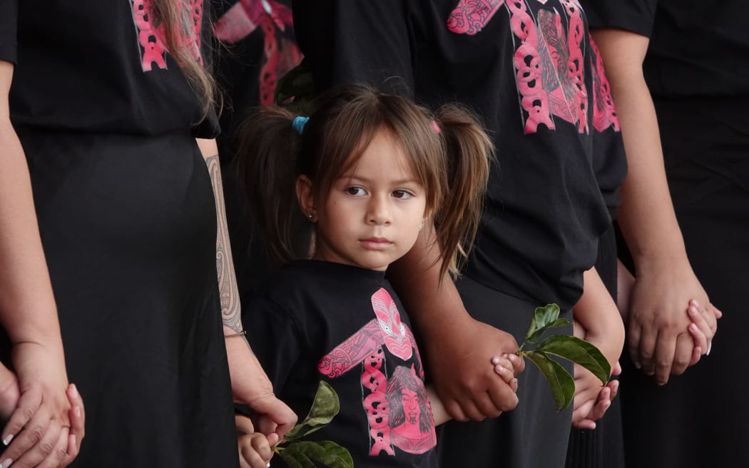 Four-year-old Te Marino Pickering awaits her turn on stage.