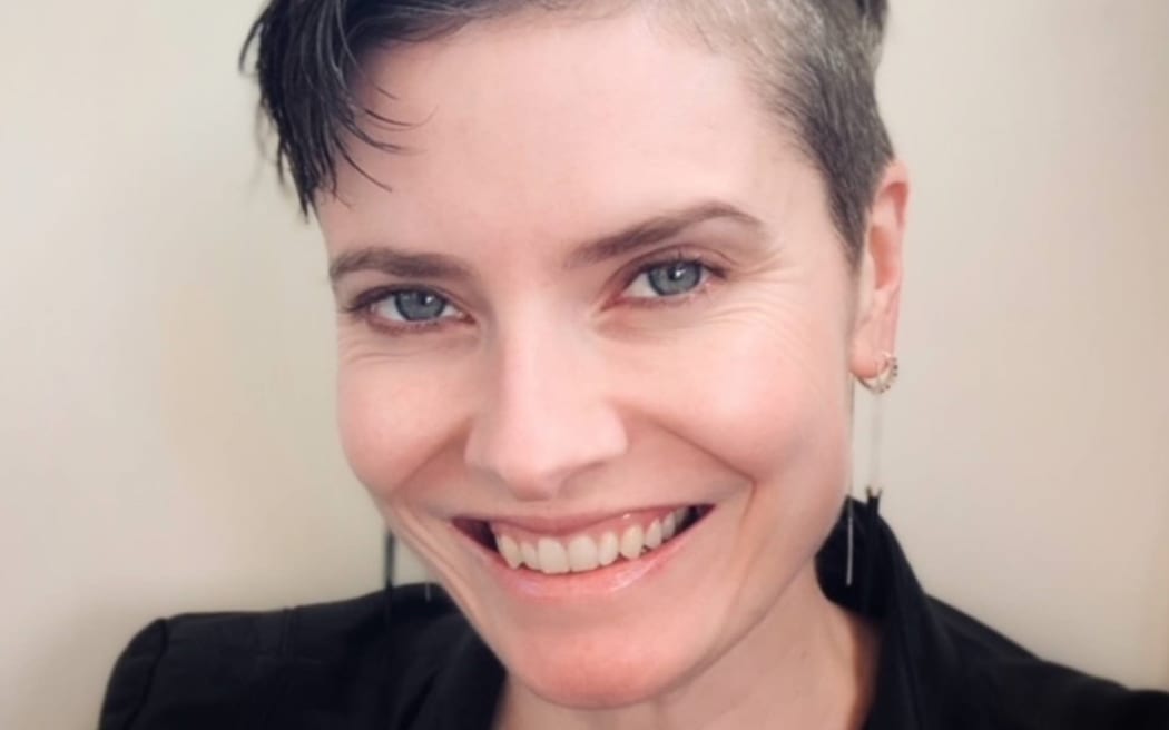 Author photo of woman with short grey hair smiling