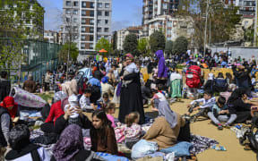 Local residents wait in a park in Istanbul on April 23, 2025, following an initial quake at 12:49 pm (0949 GMT) followed by three others of with magnitudes of 4.4 to 4.9. An earthquake with a magnitude of 6.2 hit the Marmara Sea near the western outskirts of Istanbul on April 23, 2025, officials said, with the impact felt across Turkey's largest city where people rushed onto the streets.