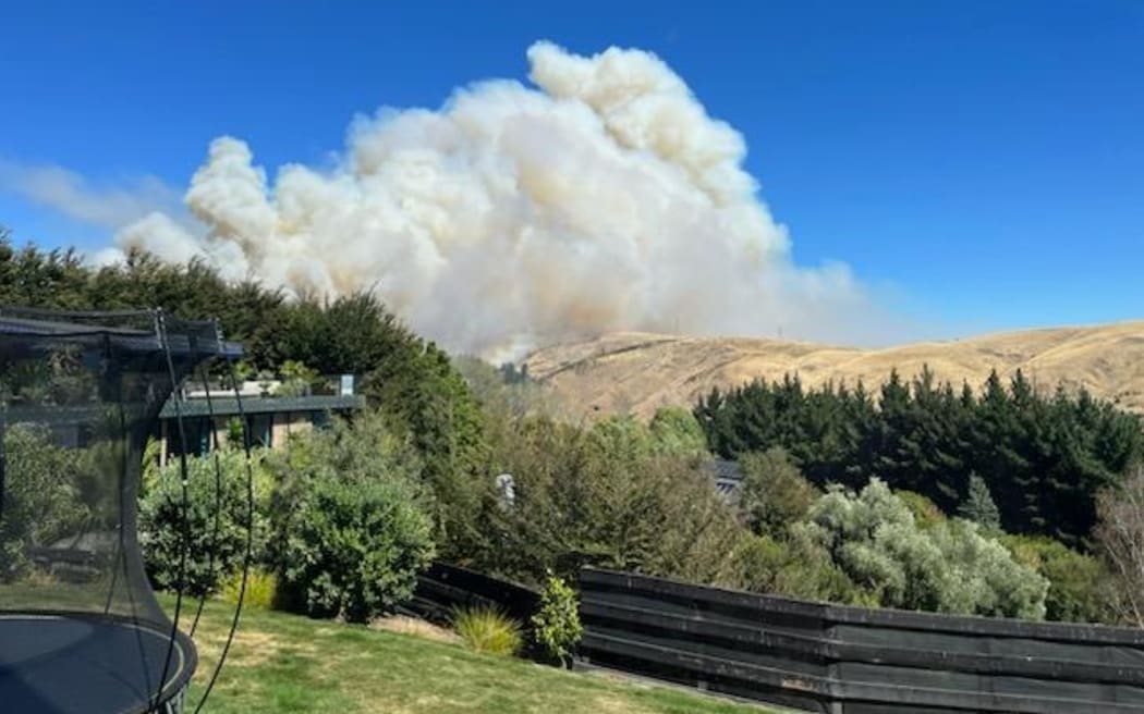 Firefighters continue to battle fire in the Port Hills near Christchurch on 15 February, 2024, after it broke out the day before.