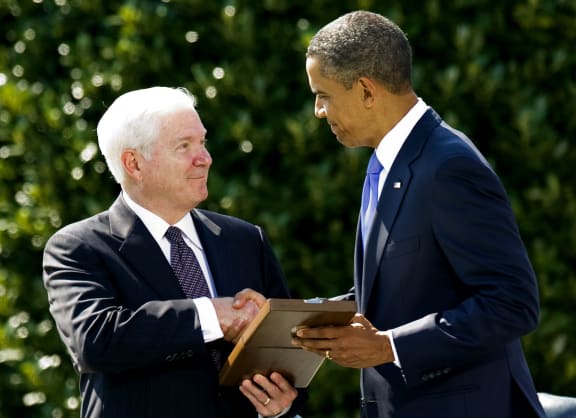 President Obama with Robert Gates (right) at his farewell ceremony in 2011.