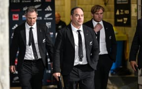 New Zealand All Blacks assistant coach Scott Hansen followed by assistant coach Leon MacDonald and New Zealand coach Scott Robertson.