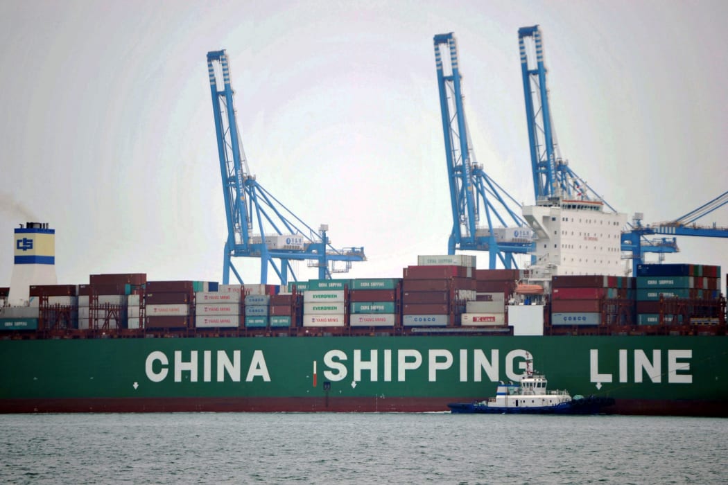 Cargo containers wait to be transported at a port in Qingdao