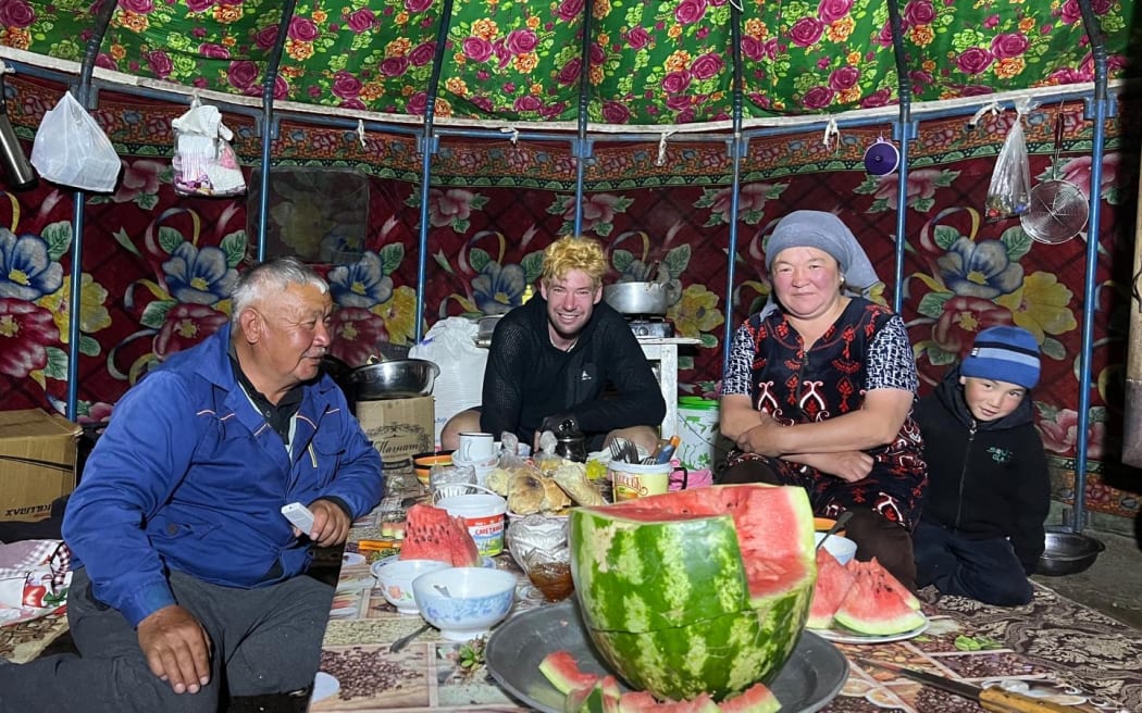 Cyclist Joe Nation enjoying some local hospitality during the Silk Road Mountain Race.