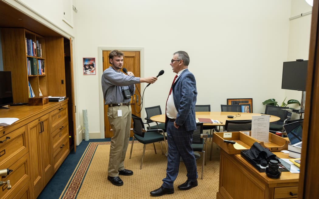 Louis Collins (left) interviews Duncan Webb in the MP's office at Parliament.