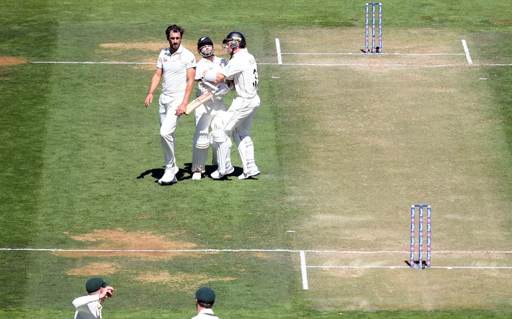 Australia's Manus Labuschagne prepares to throw the stumps to run out Kane Williamson who has collided mid-pitch with teammate Will Young.