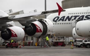This picture taken on June 1, 2018 shows ground staff preparing a Qantas Airbus A380 aircraft for flight at the Sydney International airport.