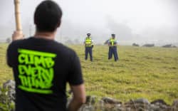 Protester and police at Ihumatao.