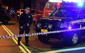 A police officer at a checkpoint in the Sydney inner suburb of Surry Hills.