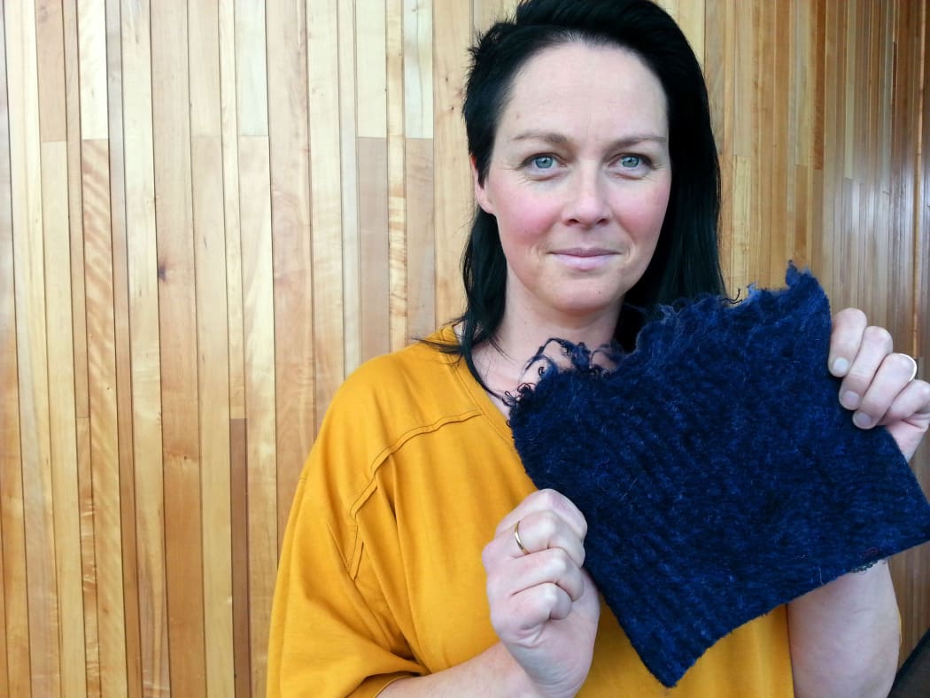 Donna Cleveland holds her recycled material.