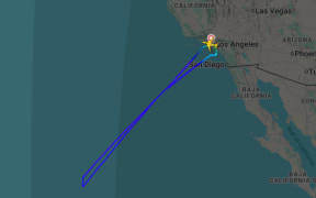 The plane turned back to Los Angeles shortly after takeoff.