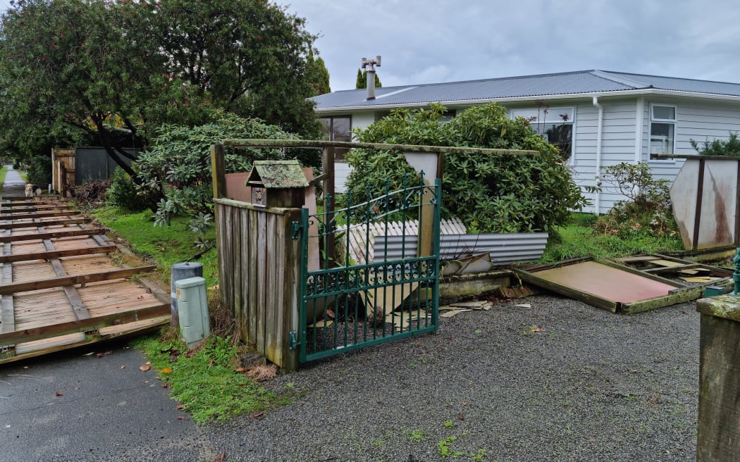 Debris and a destroyed fence after a suspected tornado in Waikanae on 9.6.2022.