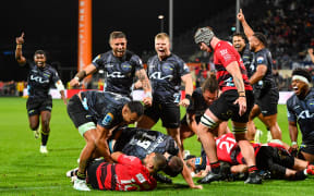 Hurricanes celebrate Justin Sangster's match winning try.