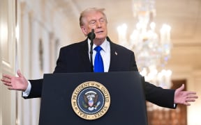 US President Donald Trump speaks during the Angel Families Remembrance Ceremony in the East Room of the White House in Washington, DC, on February 23, 2026. (Photo by SAUL LOEB / AFP)