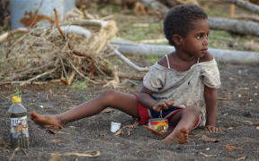 Jessica plays in the sand at Port Narvin on Erromango Island in Vanuatu. 25 March 2015