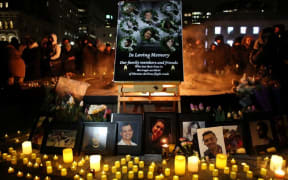 OTTAWA, ON - JANUARY 09: An altar with photographs of the victims who were killed in a plane crash in Iran is seen as people gather around to held a vigil in their memories on January 09, 2020 in Ottawa, Canada.