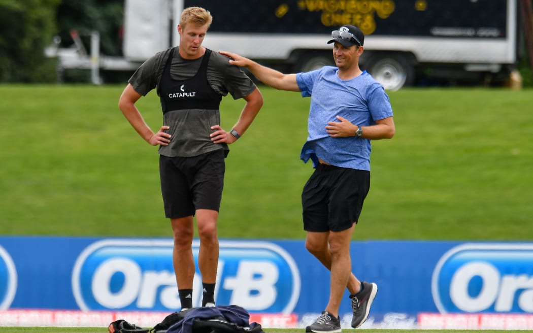 Kyle Jamieson gets some bowling in with Shane Bond.