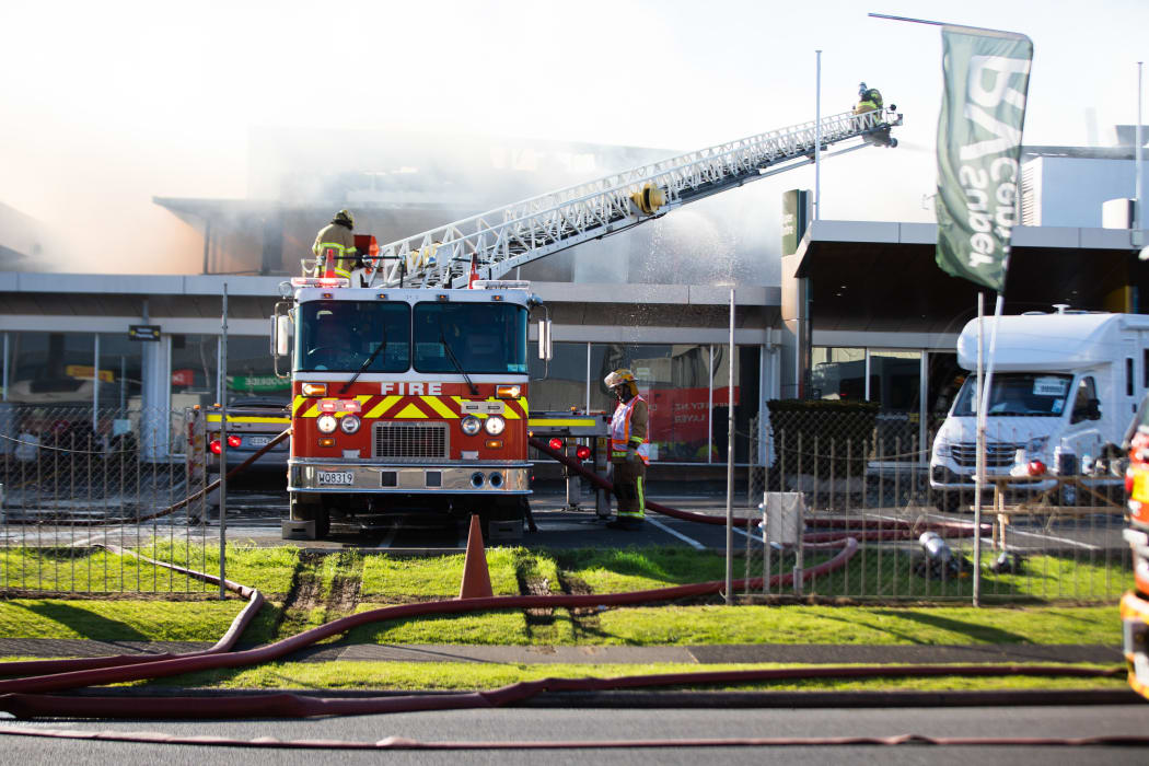 Firefighters battle a blaze that broke out at Maui campervan rental facility in Māngere, South Auckland on the morning of 3 September.